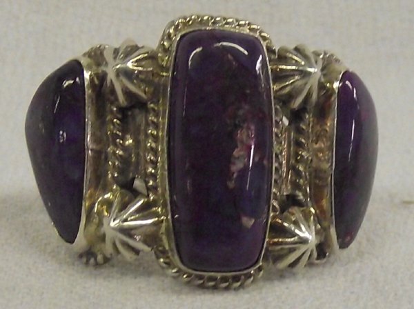 Navajo Sterling Sugilite Ring by Running Bear: Navajo Sterling Sugilite Ring by Running Bear; this piece features 3 fabulous purple sugilite cabochons; largest measures .75in x .25in set in sterling silver; size 6.5 and is almost 1in long; artist