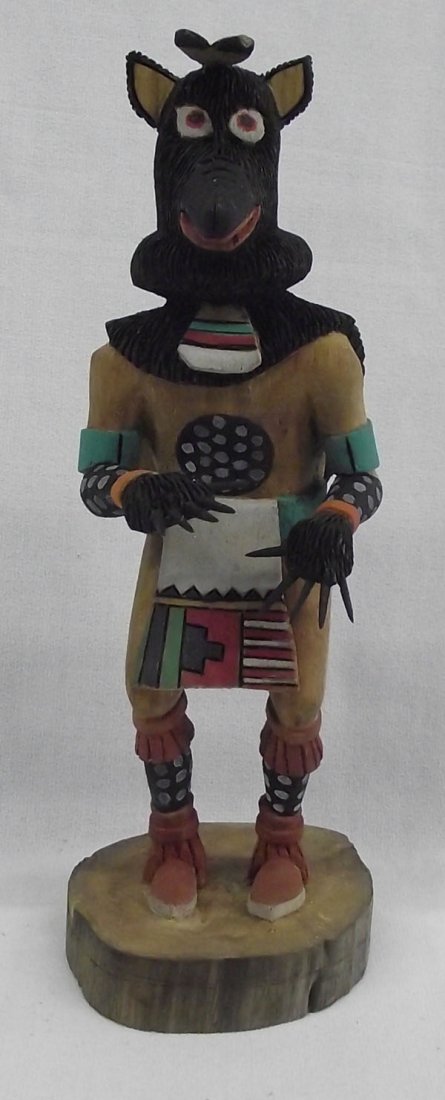 Hopi Wolf Kachina by Silas Youvella: From the collection of Nick & Suzanne Nicholas. Hopi Wolf Kachina by Silas Youvella, measures 8.5''h x 3''w. Great piece showing the wolf pelt draping down the back with sharp claws for fingers. Signe