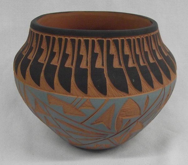Carved Acoma Polychrome Jar, Signed: From the collection of Nick & Suzanne Nicholas. Carved Acoma Polychrome Jar, Signed, measures 5.5''h x 7''w. Signed with initials ''DSH''''Acoma NM''. Nice geometric carving.