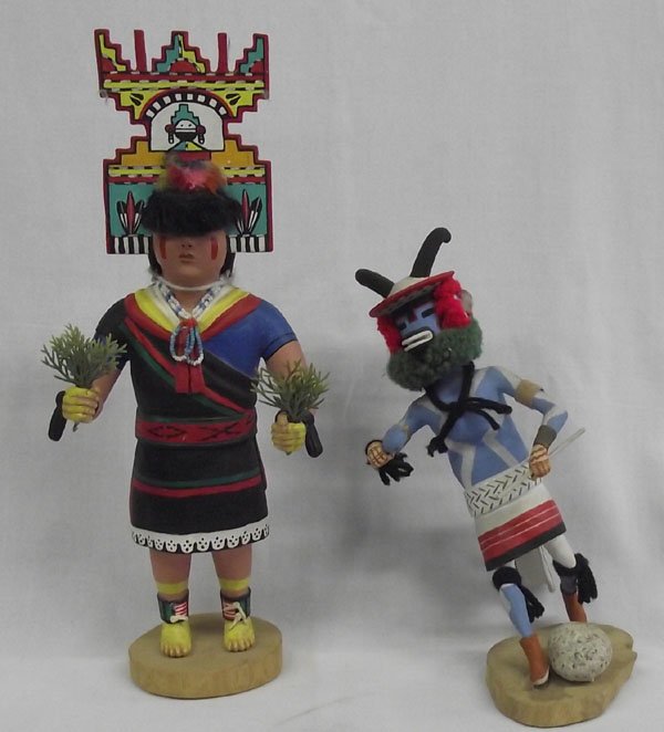 Hopi Hand Carved Kachinas one by Stacy Telahytewa: From the Nick and Suzanne Nichaolas Collection we have a Hopi Hand Carved Kachinas, largest measures 16''H x 6.5''W and is a young female dancer in full Hopi regalia wearing a hand painted Tableta on