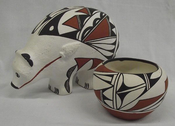 Acoma Jar and Isleta Bear Pottery: From the Nick and Suzanne Nicholas Collection we have an Acoma bowl painted in the traditional black-white-and terra cotta colors embellished with Native American geometric and line designs and measur