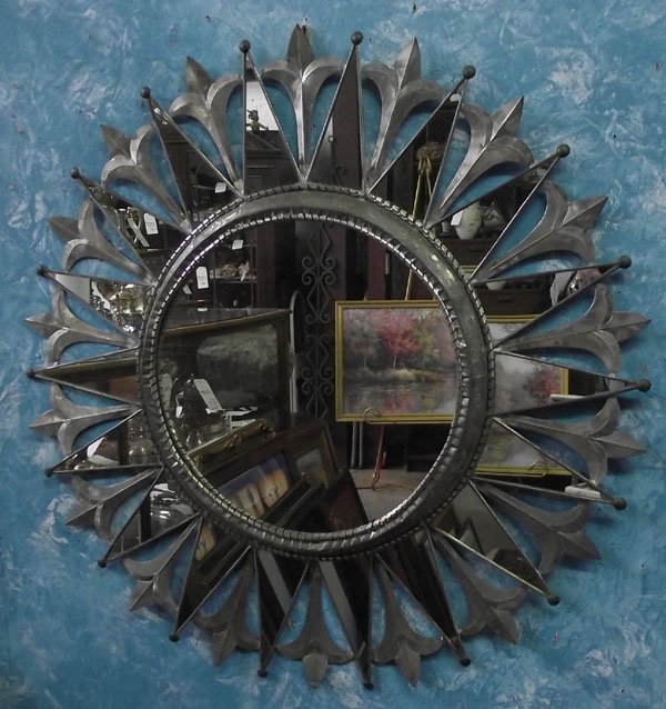 Mexican Tin Star Mirror: Mexican Tin Star Mirror, hand hammered bezel around mirror, measures 27.5'', ornate