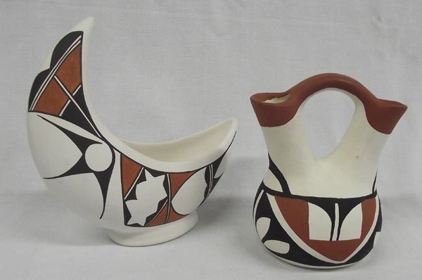 Isleta Pottery by Jojola: From the Nick and Suzanne Nicholas Collection we have Isleta Pottery by Jojola, #1 Wedding Polychrome Vase, measures 5.5''H x 4.5''W, terra cotta-black-cream, signed on bottom ''C. Jojola Isleta, N.M.