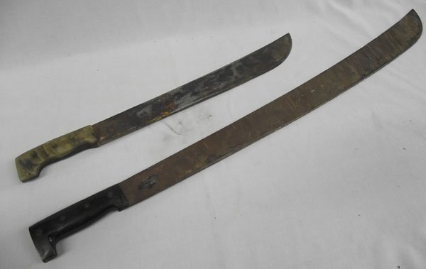 Vintage Mexican Machetes: Vintage Mexican Machetes, longest measures 31'' X 2''W, one has a horn handle, one has a partial sticker written in Spanish