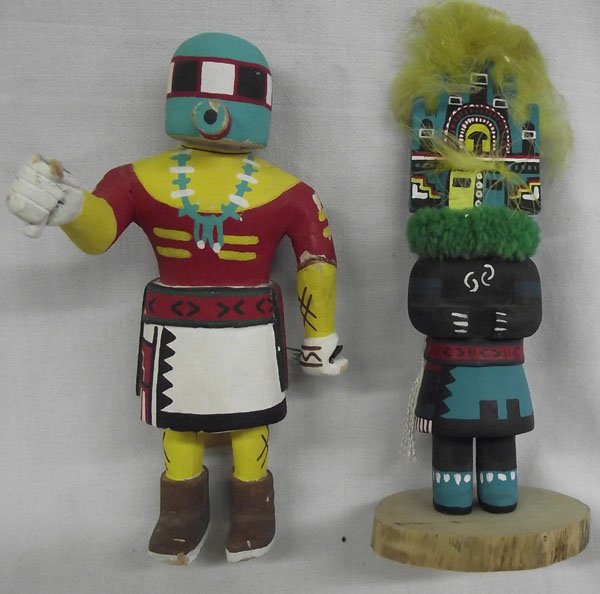 Two Hopi Kachinas: From the collection of Nick & Suzanne Nicholas. Two Hopi Kachinas, the larger measures 8''h and has a tag, ''Rattle Kachina'' by Francis Duwahoya and has some damage, missing the rattle and top piece.