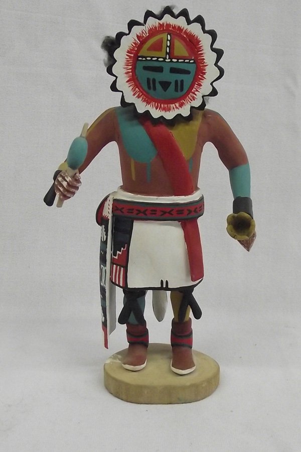 Hopi Sun Face Kachina by Murray Harvey: From the collection of Nick & Suzanne Nicholas. Hopi Sunface Kachina by Murray Harvey (Hopi First Mesa). Measures 8'' high x 4'' wide. Brightly painted, holding dance rattle. Traditional painted sunfa