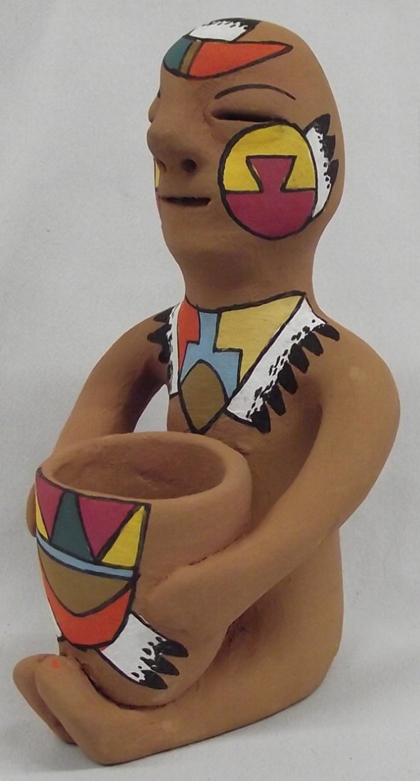 Tesuque Pueblo Rain God Pottery Figurine: Tesuque Pueblo Rain God Pottery Figurine. Figurative pottery from New Mexico pueblo potters has a long tradition. The earliest documented Rain God from Tesuque was collected in 1879. They have existed