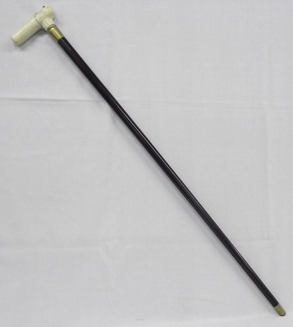 Wood & Brass Cane w/Carved Bone Rabbit Handle: Wood & Brass Cane w/Carved Bone Rabbit Handle. This really unique walking cane is brass tipped wood with a beautifully carved bone handle in the shape of a rabbit. Has some age, but is in good consdit