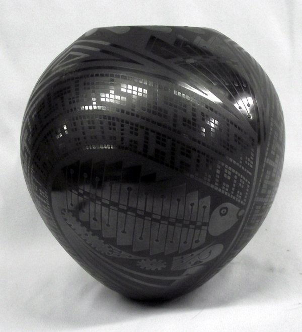 Mata Ortiz Black on Black Fish Jar by Tito Mrin: Mata Ortiz Black on Black Fish Jar by Tito Mrin, measures 7'' x 7'', beautiful gun metal finish, features eyedazzling checkerboard, abstract, and geometric designs, seed jar design in structure, teard