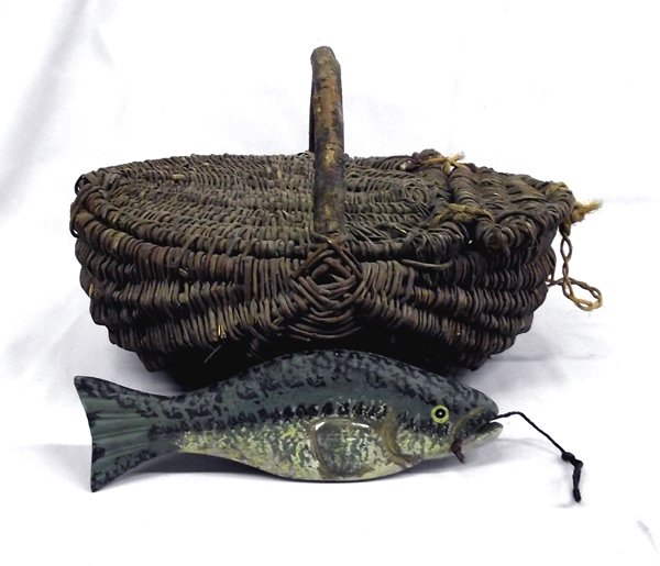Antique East Coast Fish Basket with Wooden Fish: Antique East Coast Fish Basket with Wooden Fish from the Nick and Suzanne Nicholas Collection. Measures approx. 5'' x 12'' x 14''. Traditional Buttox Basket with wooden handle. Good condition for age.