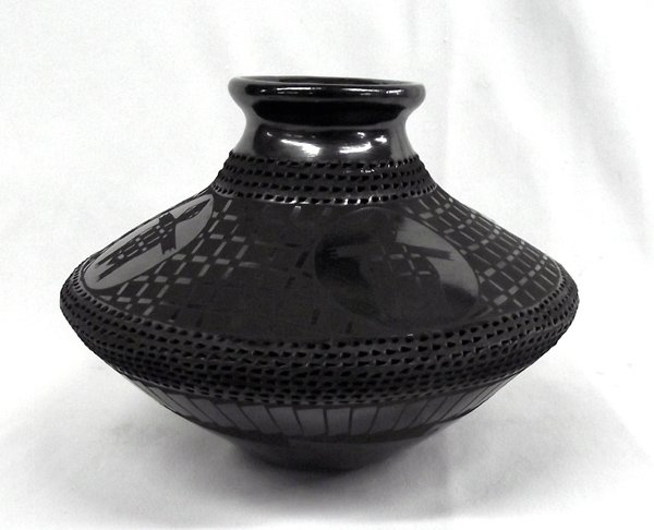 Mata Ortiz Black on Black Turtle Olla by B. Soto: Mata Ortiz Black on Black Turtle Olla by Benjamin Soto, measures 6''H x 8''W, gun metal finish, textured around rim and mid section of jar, features 4 medallions accented with turtles, stylized feathe