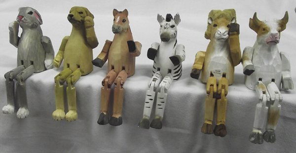 Set of Bass Wood Carved & Painted Sitting Animals: Set of Bass Wood Carved & Painted Sitting Animals. These sweet critters include a ram, zebra, horse, steer, rabbit, and dog. The horse measures approx. 7''H x 2.5''W. Great stocking stuffers!