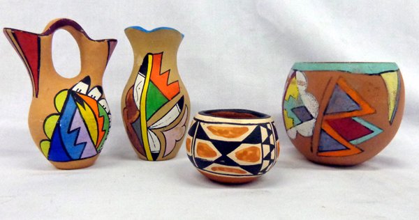 Collection of 4 Jemez and Santo Domingo Pottery Jars: From the Collection of Nick & Suzanne Nicholas comes these original Jemez and Santo Domingo vases and pots. The largest measures aprox. 5'' x 2.75''. These sweet items are brightly colored and show so