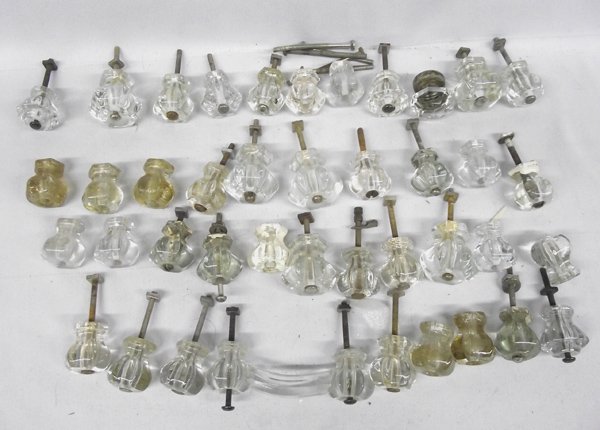 Vintage Large Group of Glass Pulls with One Handle: Vintage Large Group of Glass Pulls with One Handle. Approx 40. Most measure 1.5'' x 1.5'' and vary in styles. Most have hardware.