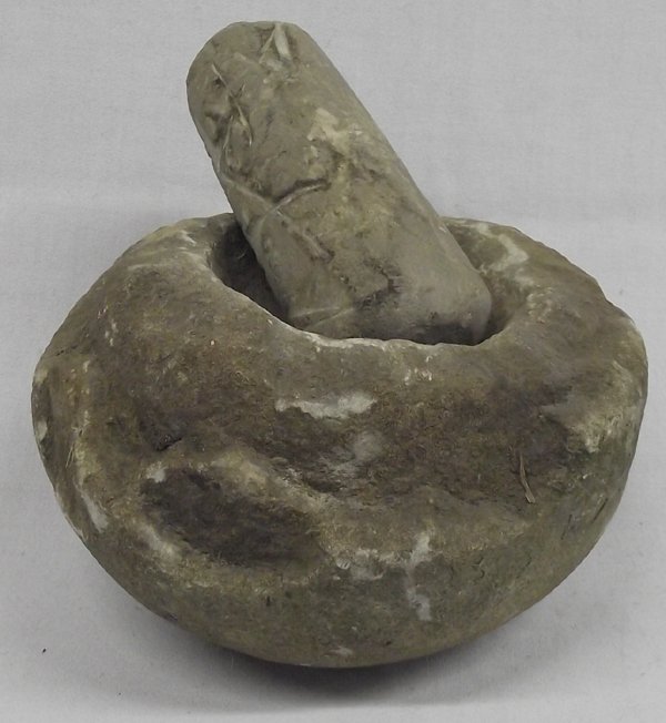 Stone Grinding Bowl and Pestle: Stone Grinding Bowl and Pestle. These 2 unique pieces are honed out of solid rock. The pestle is approx.7.5'' long and 5.5'' in diameter.