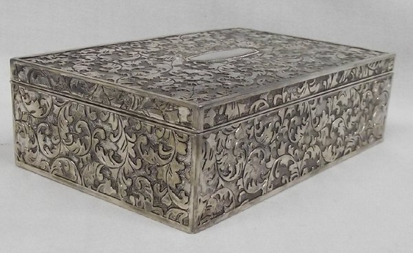 Vintage Velvet Lined Embossed Metal Trinket Box: Vintage Velvet Lined Embossed Metal Trinket Box. 1.75''H x 6.25''L x 3.75''H. Center frame could be engraved with a name. Heavy, clean and nice. From Proctor Collection, Silver City, New Mexico.