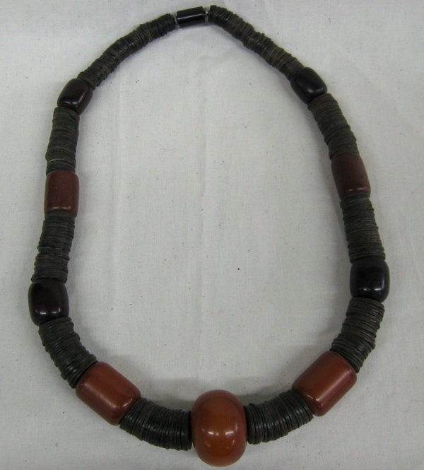 Ethnic Necklace: Ethnic Necklace, measures 24'' end to end with the largest bead measuring 1.4''D, features beautiful amber colored beads with sections of dark brown flat spacer beads, striking piece