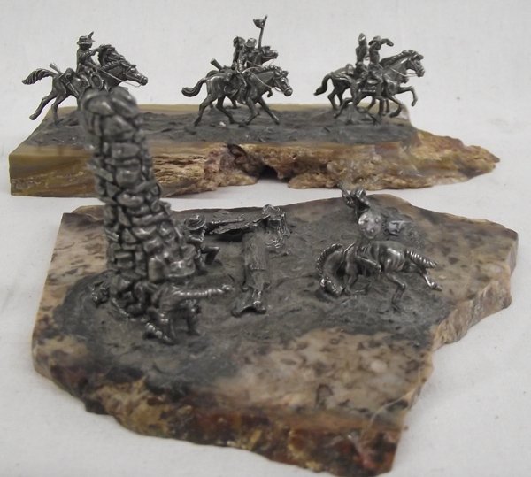 Pr 1983 Pewter Miniature Sculptures by Ken Dettling: Pr 1983 Pewter Miniature Sculptures by Ken Dettling. 1- Pewter Western Soldier Riders on Petrified Wood signed by artist. 2- Pewter Cowboy Indian Shootout on Rock Slab. Largest measures 3'' x 7''L.
