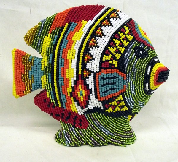 Hand Beaded Fish by Kills Thunder: Hand Beaded Fish by Kills Thunder. Item has vivid colors and measures approx. 9''H x 10''L x 2.5''W. Kathleen Kills Thunder was born in Seattle, Washington. Kathy has been painting and beading since s