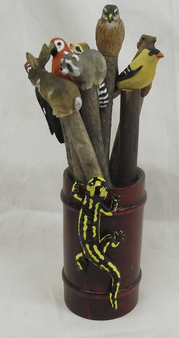 Carved Basswood Animal Figure Pens & Holder: Carved Basswood Animal Figure Pens & Holder. A variety of hand-carved and painted animal figure pens with holder. The holder has a carved and painted gecko. The longest pen measures 8'' and the pen ho