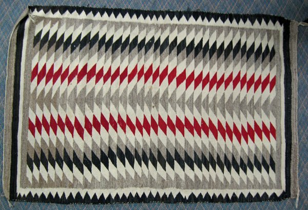 Vintage Navajo Traditional Eye Dazzler Rug: From the Collection of Nick & Suzanne Nicholas we have this Vintage Traditional Eye Dazzler Navajo Rug. In vibrant colors this piece measures approx. 36'' x 56'' and is in great condition for its age.