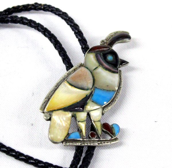 Zuni Sterling Channel Inlay Quail Bolo Tie: Zuni Sterling Bolo Tie Large Quail Bolo, Multi-Stone. Dimensional carved stones, channel set. Includes mother-of-pearl, turquoise, abalone, red jasper and onyx. The bolo measures 2 5/8'' high x 2'' wi