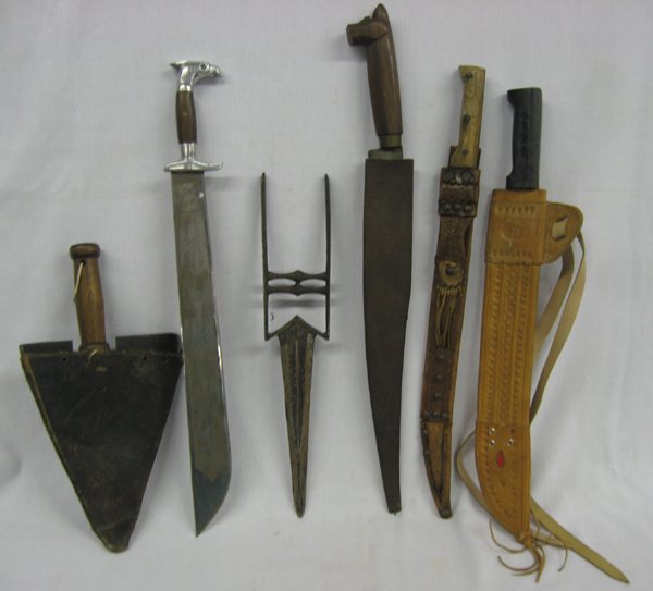 Collection of Six Knives: Collection of Six Knives. Longest is 22''. Four knives have sheaths. 2-Mexican Eagle head Sword Machetes WWII Fighting Knives with engravings on both sides of the blades. Heavy leather sheath. One wit