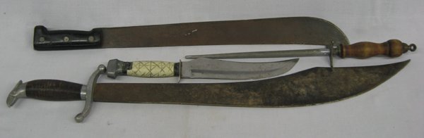 Knife and Machete Collection: Knife and Machete Collection, largest measures 27.5'' x 4.5'', #1 Knife blade is marked Stainless Brazil, carved handle #2 Black handled machete, blade is marked made in Sheffield England #3 Wood hand