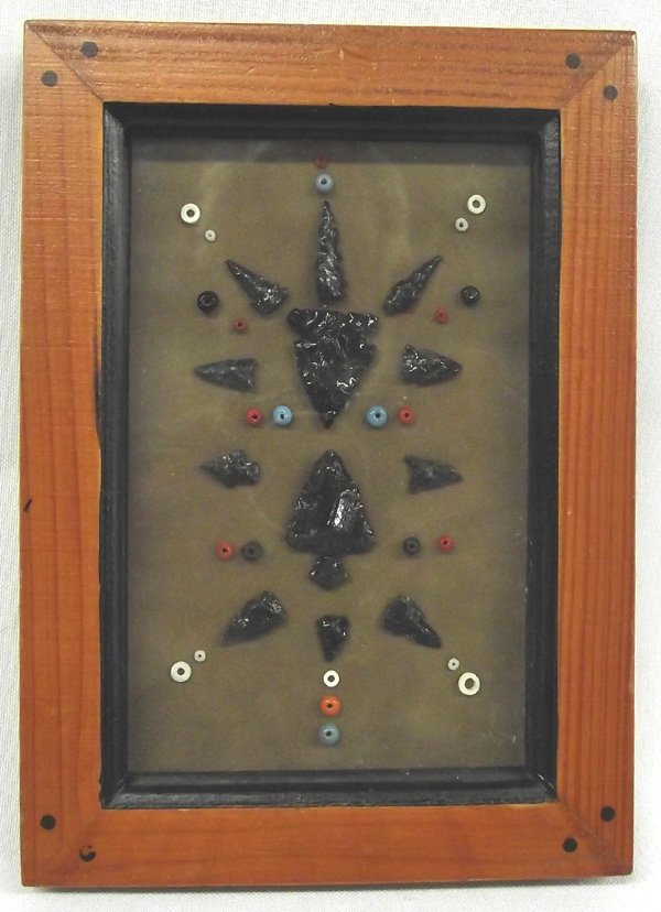Collection Obsidian Arrowheads & Bone Beads: Collection Obsidian Arrowheads & Bone Beads, Glass Beads. Most of the arrowheads are Bird Points (10) with two larger arrowheads that measure approx. 1.5"W. Framed in a redwood frame with bone, & glas