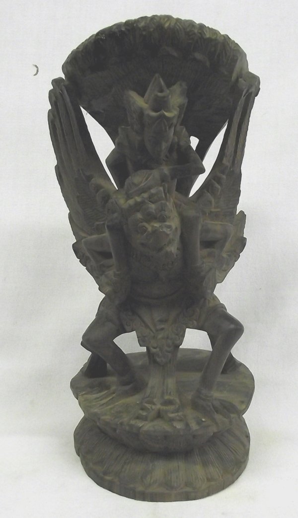 Antique Hindu Wooden Vishnu riding a Garuda: This is an old carving from Indonesia or India of a Garuda (winged creature). This one typically has Vishnu riding on the back. Garuda can be Buddhist or Hindu. This is Hindu, with Vishnu riding the G