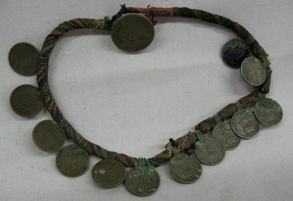 1950-60s Nepal Indian Coin Choker: 1950-60s Nepal Indian Coin Choker. Decorated on cloth cords with coin closure. 12'' end to end. Unique.