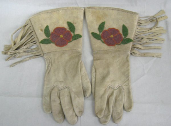 Vintage Leather Beaded Ladies Rodeo Show Gauntlets: Vintage Leather Beaded Ladies Rodeo Show Gauntlets. These gloves have a beaded flower with leaves, fringe, colored stitching and are a size small. They measure approx. 12'' in length.