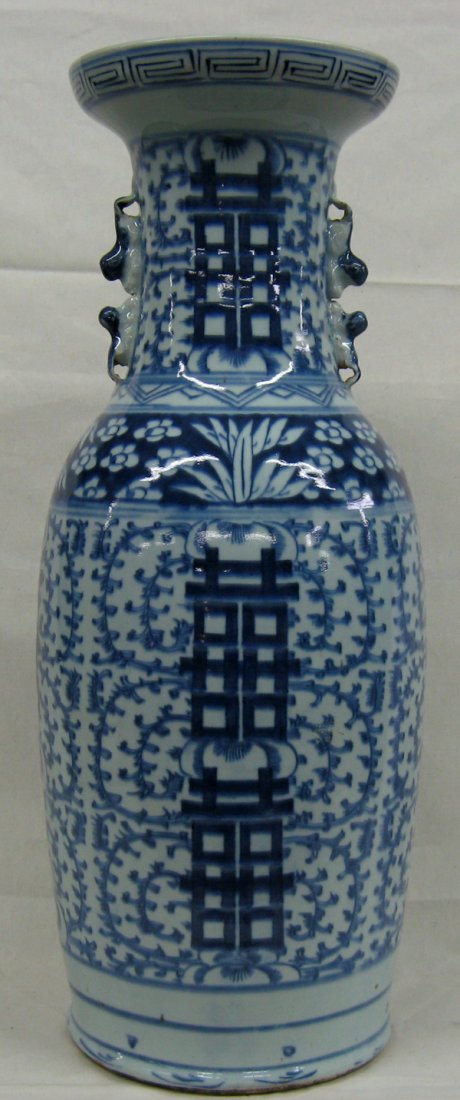 Antique Chinese Blue & White Porcelain Vase: From the Proctor Collection, a tall Chinese antique porcelain blue and white imported flower vase. Foo Dog handles. Measures 23.5''H x 8''W. Export tag on bottom of Vase