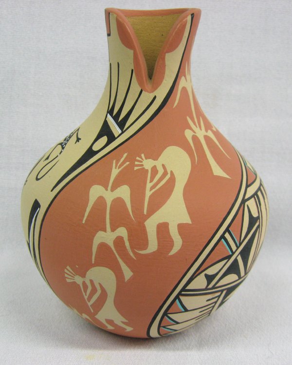 Jemez Polychrome Pottery Jar- JB Toya: From the Van Yaryan Collection, Silver City NM, we have a Jemez Polychrome Pottery Jar- JB Toya. Kokopelli design. 4.5''H x 4'' diameter. Certificate of authenticity included.