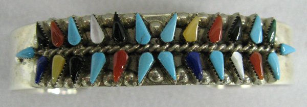 Zuni Sterling Multi Stone Bracelet Vera Halusewa: Zuni Sterling Multi-Stone Bracelet - Vera Halusewa. 6.5'' wrist x .5''H. Hallmarked V. Halusewa and stamped ''sterling'' inside. Jet, mother of pearl, turquoise and coral teardrop fashioned stones. Lo