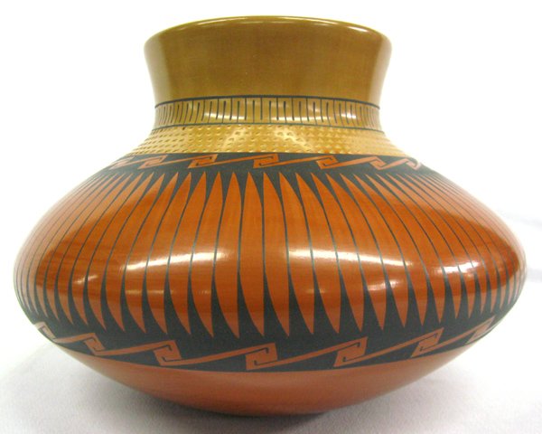 Mata Ortiz Polychrome Pottery Jar - Amando Silviera: Mata Ortiz Polychrome Jar- Amondo Silvier. 7.5''H x 11'' diameter. Textured neck. Mata Otiz is a village in Chihuahua Mexico specializing in hand made and painted pottery.