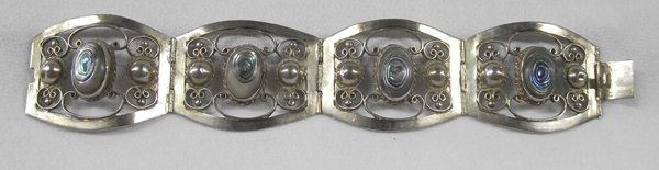 Taxco Sterling Abalone Bracelet: Taxco Sterling Abalone Bracelet, measures 1.5''W x 7'' end to end, Large sterling silver bracelet set with abalone sehll cabochons, hallmarked, hinged with filagree style accents