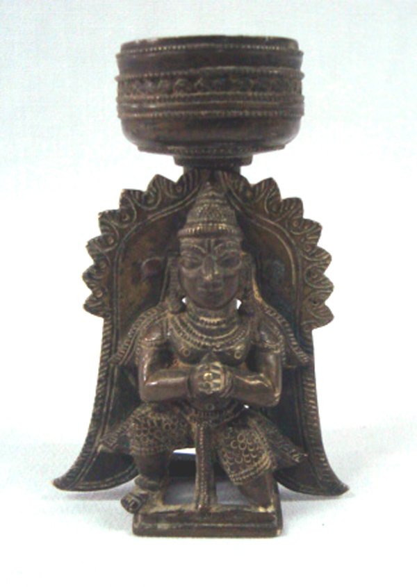 Nepalese Brass Devotional Candlestick: Nepalese Brass Devotional Candlestick. Measures 4.5'' tall x 3'' wide.