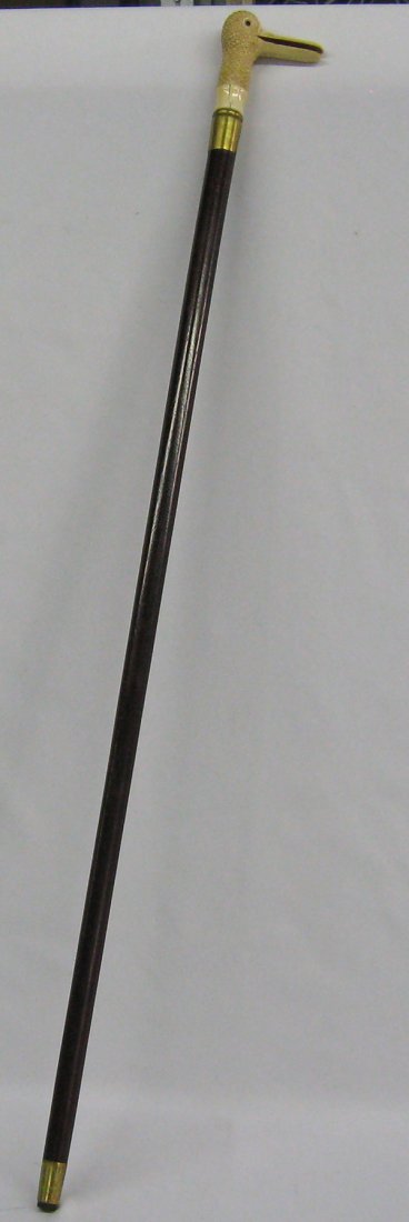 Walking Cane with Carved Bone Duck Head Handle: Carved Bone Duck Headed Cane. Measures 3'.