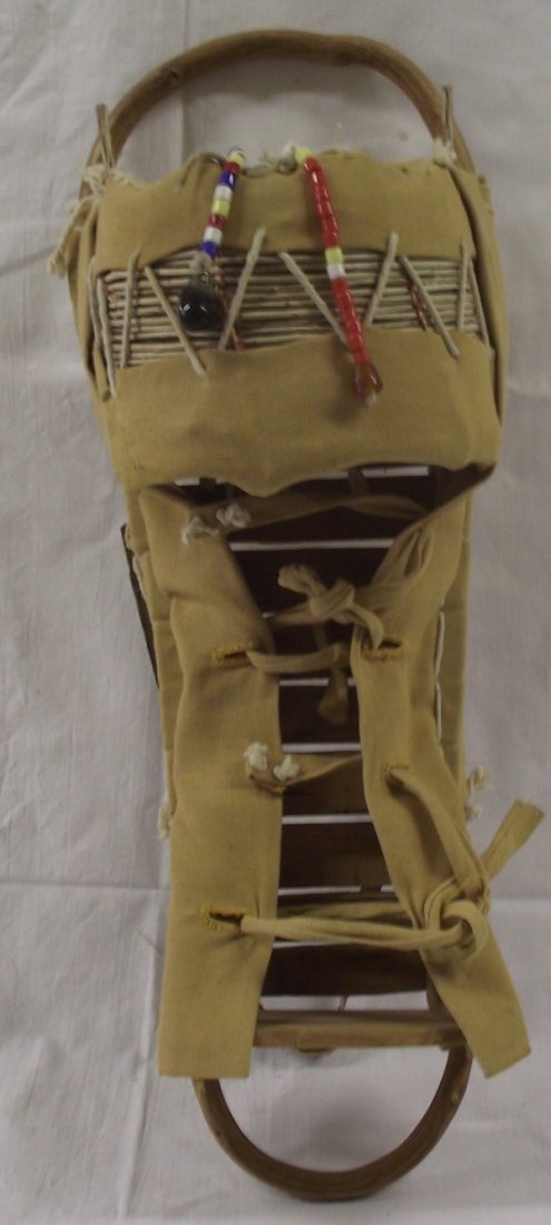 Apache Doll Cradleboard: Apache Doll Cradleboard, measures 21.5''L x 8.5''H x 8''W, made of wood and canvas
