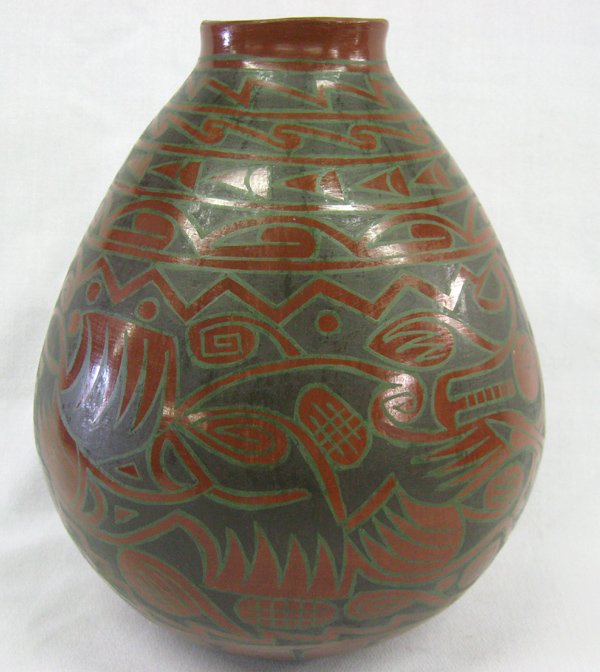 Mata Ortiz Polychrome Pottery Jar by Gonzalez: Mata Ortiz Polychrome Pottery Jar by Gonzalez, measures approx. 9''X 9''. Mayan design all around the pottery in black and grey on red.