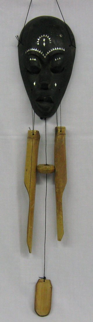 Lombok Indonesia Carved Wooden Mask with Chimes: Mask is from Lombok, Indonesia, put together with chimes in Bali. Hand Carved Wooden Mask Wind Chime, mask measures 10.5''L x 6''W and with longest bamboo chime 30''L, 1'' crack above left eyebrow, co