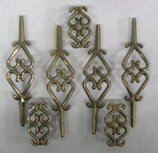 Collection of Metal Door Pulls: Collection of Door Pulls. We have 4 large and 3 smaller metal door pulls. The large pulls measure approx. 7'' long x .75'' high x 1.75'' wide.