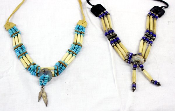 Pueblo Hairpipe Bone and Leather Necklaces: Pueblo Hairpipe Bone and Leather Necklaces, longest measures 19'' end to end, one is embellished with turquoise nugget beads, leather, and an abalone button, the other is embellished with cobalt blue