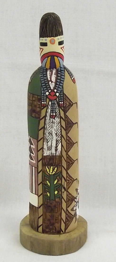 1950 Hopi Kachina by L.M. Savage: Hopi Kachina by L.M. Savage. Called ''Butterfly Girl'' this item is intricately etched and painted in vivid colors. This piece is signed on the bottom by the artist and stands approx.9.5''T x 3''W.