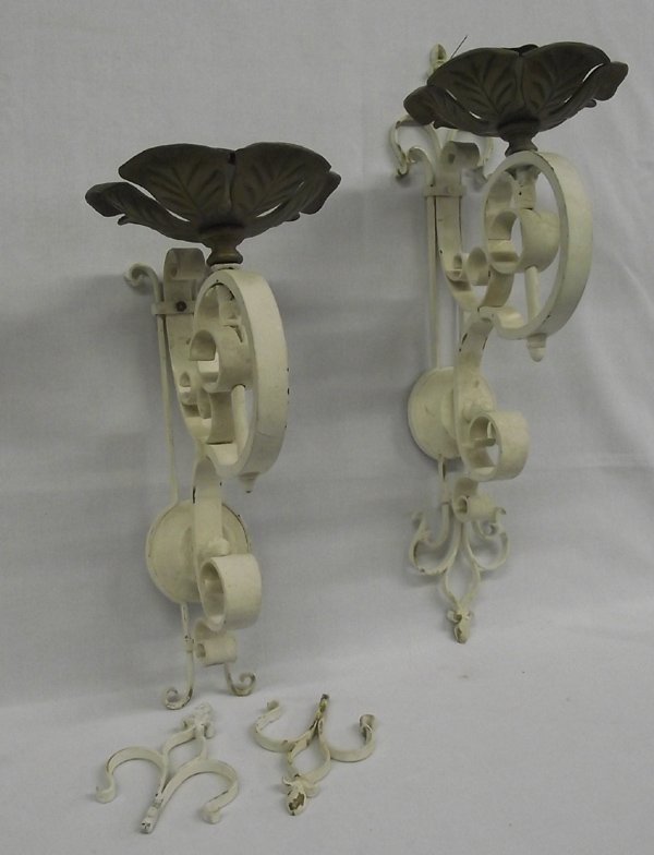 Pair Antique Wrought Iron and Brass Candle Sconces: From the Proctor Collection. Pair Antique Wrought Iron and Brass Candle Sconces. These sconces measure approx. 24''L x 8''W. One sconce has unattached top and bottom scroll pieces which come with.