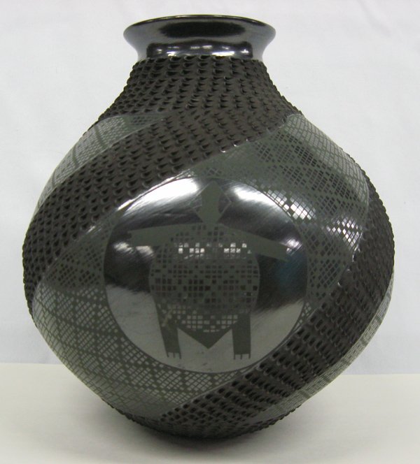 Mata Ortiz Green on Black Olla by Benjamin Soto: Mata Ortiz Green on Black Olla by Benjamin Soto, measures 11.5''H x 10.5''W, jar features eye dazzling green on black checkerboard designs with 3 highly burnished turtle medallions, each turtles has s