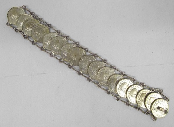 1960 Mexican Coin Link Bracelet: Mexican Coin Bracelet. Cinco Centavos coins, all 1960's, total of 17 coins, soldered rings on each and strung on chain. Measures 8'' long.