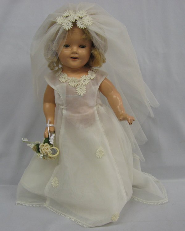 1930 Ideal Shirley Temple Composition Doll: 1930s Shirley Temple Composition Wedding Doll by Ideal, measures 19''H x 10''W x 6'', on doll stand, sleepy eyes, marked on back ''Shirley Temple'' and ''Ideal'' under hairline in back, she has red li