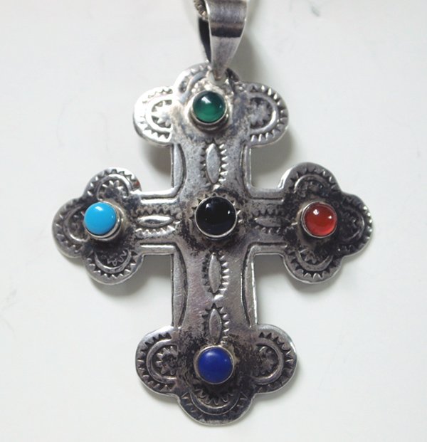 Sterling Silver Multi Stone Cross Pendant Necklace: Sterling Silver and Multi Stone Cross Pendant Necklace, cross measures 2''L and chain measures 18'' end to end, cross has a wt of 4.9g, small stone cabs of turquoise, malachite, carnelian, and lapis, 
